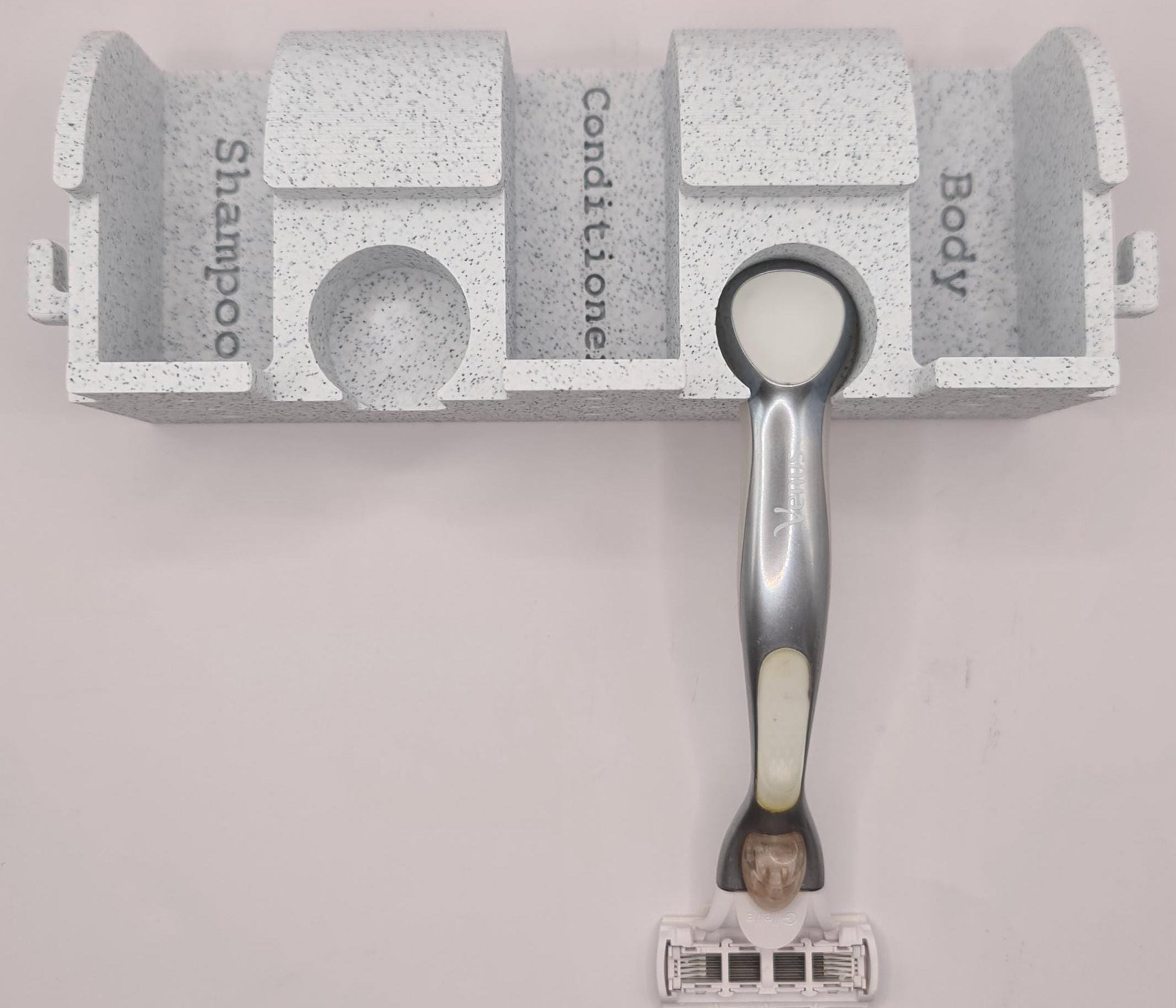 See the holder for the Venus razor and the hooks on the side for scrunchy.